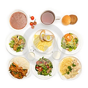 Top view of many plates with food photo