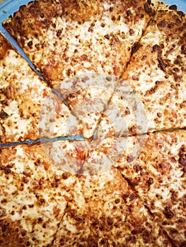 Top view of Margarita pizza with fatty mozzarella cheese and tomato sauce