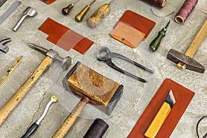 Top view materials and instruments on cutting mat for chopping measurement leatherwork details