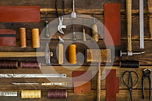 Top view materials and instruments on cutting mat for chopping measurement leatherwork details photo