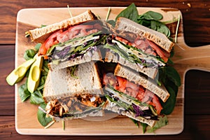 top view of a meaty, veggie-filled clubhouse sandwich