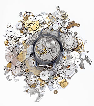 Top view of mechanic watch on heap of spare parts