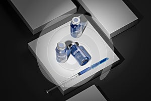 Top View On Medicine Bottle With Blue Content From SARS Coronavirus And Syringe For Vaccination. 3D rendering photo
