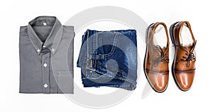 Top view men apparel, grey shirt, blue jean, leather shoes brown