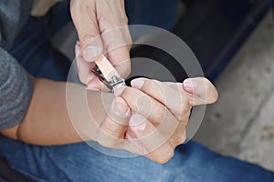 Top view of men cut his fingernails clipper.cleaning increase hygiene