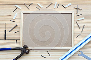 top view of metallic tools and different construction tools on wooden table.