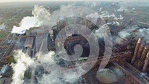 Top view of the metallurgical plant. Smoke coming out of factory pipes. ecology