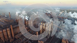 Top view of the metallurgical plant. Smoke coming out of factory pipes. ecology