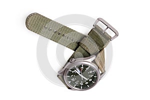 Top view military wrist watch with green nylon strap on white background