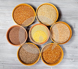 Top view of millet grains in round ceramic bowls