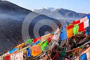 Top view monastery at Larung gar Buddhist Academy in a warm and foggy morning time, Sichuan, China