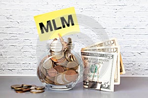 Top view of money with MLM or Multi Level Marketing wording. Business concept