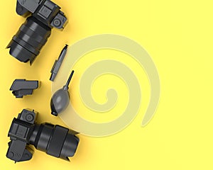 Top view of monochrome designer workspace and photography gear on yellow