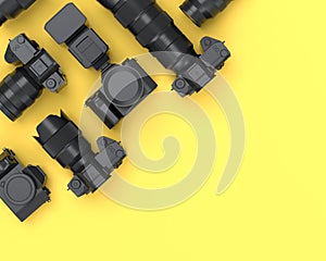 Top view of monochrome designer workspace and photography gear on yellow