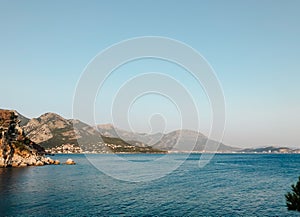 Top view Montenegro Sutomore stones beach blue turquoise Adriatic sea water mountains day