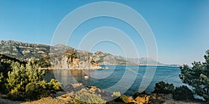 Top view Montenegro Sutomore stones beach blue turquoise Adriatic sea water mountains day