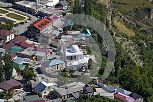Top view of the mosque surrounded by houses. The mountain village of Gunib. Dagestan
