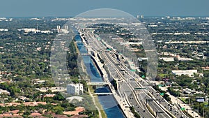 Top view of mulitlane american highway with rapid driving cars during rush hour in Miami, Florida. View from above of