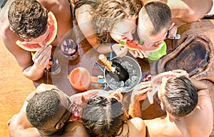 Top view of multiracial friend having fun at sail boat party