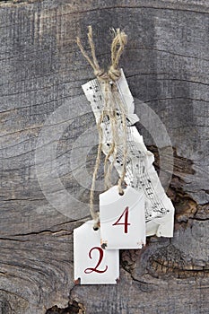 Top view of music sheet and 24 for christmas on wooden backgrou