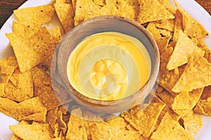 Top view of nachos with cheese dip