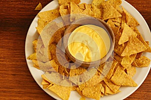 Top view of nachos with cheese dip