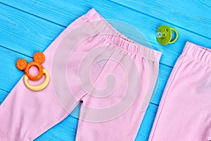 Top view of natural leggings for baby-girl.