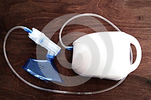 Top view of a nebulizer - a drug delivery device used to administer medication in the form of a mist inhaled into the lungs.