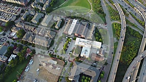 top view of neighborhood living houses,construction site, traffic intersection and route freeway in dallas by Sunset