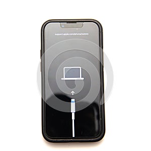 Top view new Apple iPhone mini 13 in protective case showing support .apple.com iphone restore issue error message isolated on