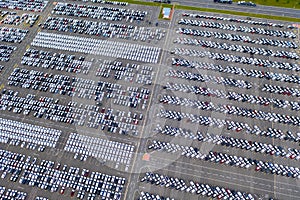 Top view of new cars lined up outside an automobile factory for import & Export