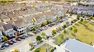 Top view new townhome cottage style houses near community park with public art installation suburbs Dallas, Texas