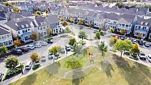 Top view new townhome cottage style houses near community park with public art installation suburbs Dallas, Texas