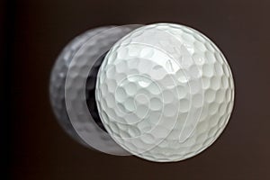 Top view the new white golf ball with the reflection, sport concept.