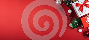 Top view new year and christmas composition on red background, banner with copy space
