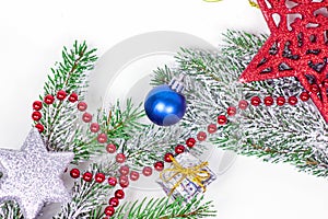 Top view of New Year and Christmas decorations with green fir tree branches as a frame with copy space for greeting invitation