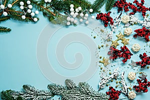 Top view on new year composition on light blue background with colorful decoration ornaments things. Concept of winter, christmas