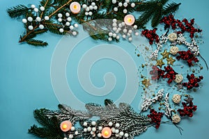 Top view on new year composition on light blue background with colorful decoration ornaments things. Concept of winter, christmas