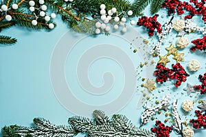 Top view on new year composition on light blue background with colorful decoration ornaments things. Concept of winter, christmas