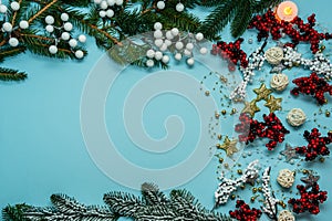 Top view on new year composition on light blue background with colorful decoration ornaments things. Concept of winter, christmas