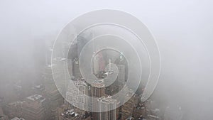 Top view of New York skyline in rainy and cloudy day. Skyscrapers of NYC in the fog.