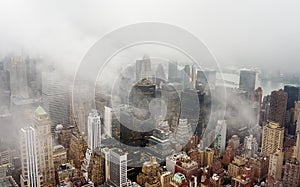 Top view of New York skyline in rainy and cloudy day. Skyscrapers of NYC in the fog