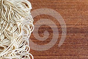 Top view of noodles on wooden board in horizonta