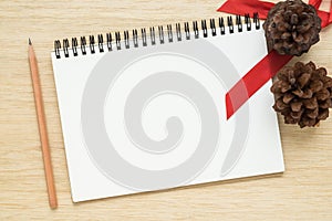 Top view of notebook on wooden background