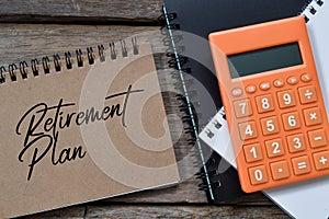 Notebook written with text RETIREMENT PLAN. Top view