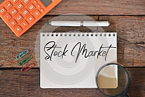 Top view of notebook written with text STOCK MARKET