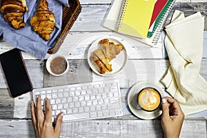 top view of office, business woman working and take her breakfast