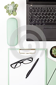 Top view of office desk. Table with laptop and office supplies. Flat lay home office workspace, remote work, distant learning,