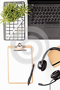 Top view of office desk. Table with laptop and office supplies. Flat lay home office workspace, remote work, distant learning,