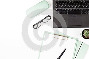 Top view of office desk. Table with laptop and office supplies. Flat lay home office workspace, remote work, distant learning,